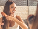 Woman using best stay-at-home haircare products